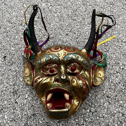 Modern hand crafted Diablo mask with ribbons.