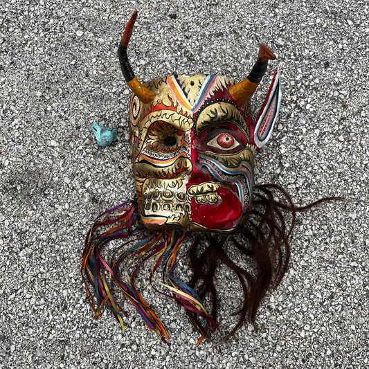 Split personality day of the dead Diablo mask.