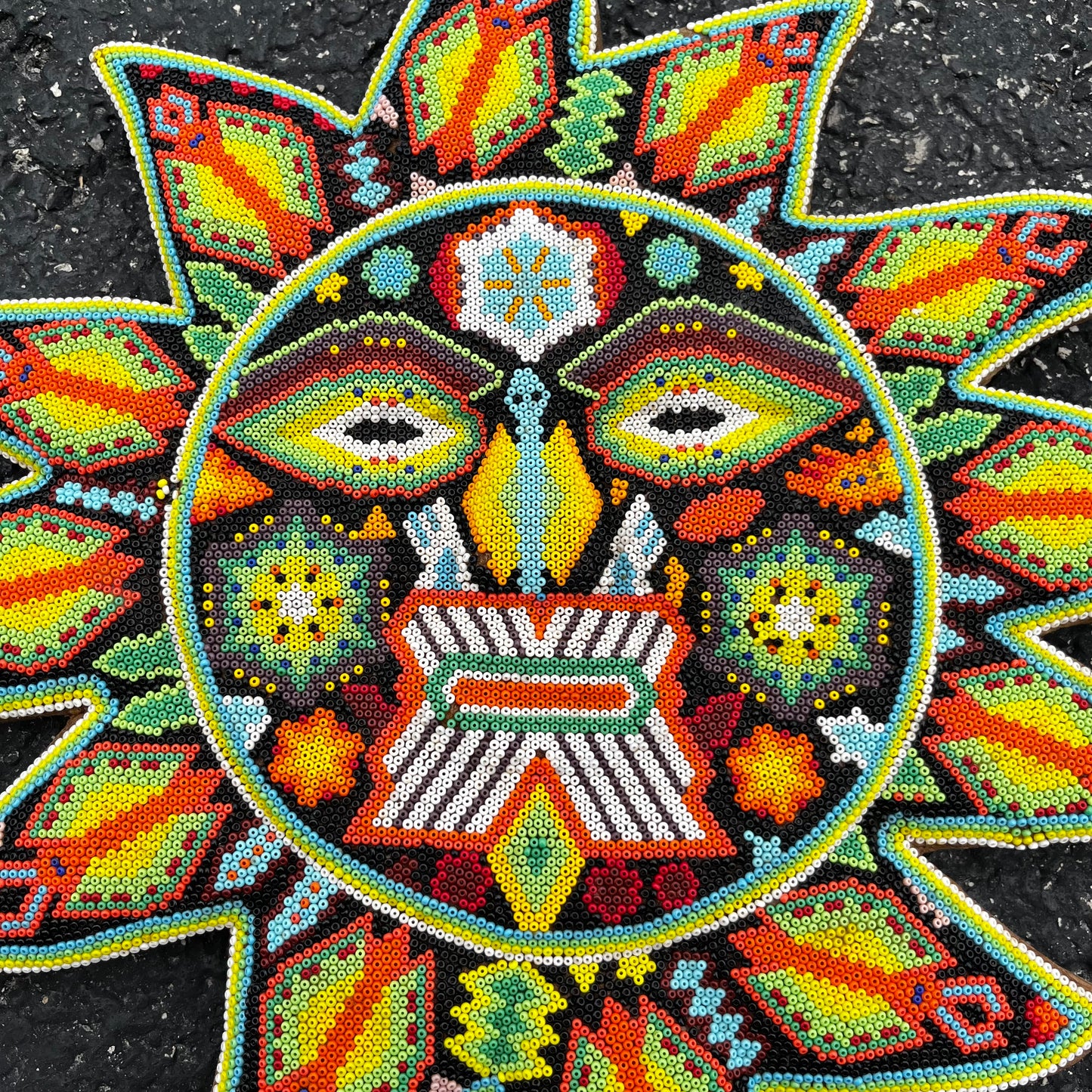 Vintage hand crafted Huichol sun.