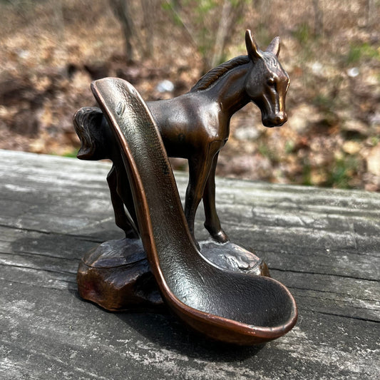 Vintage bronze horse pipe holder.