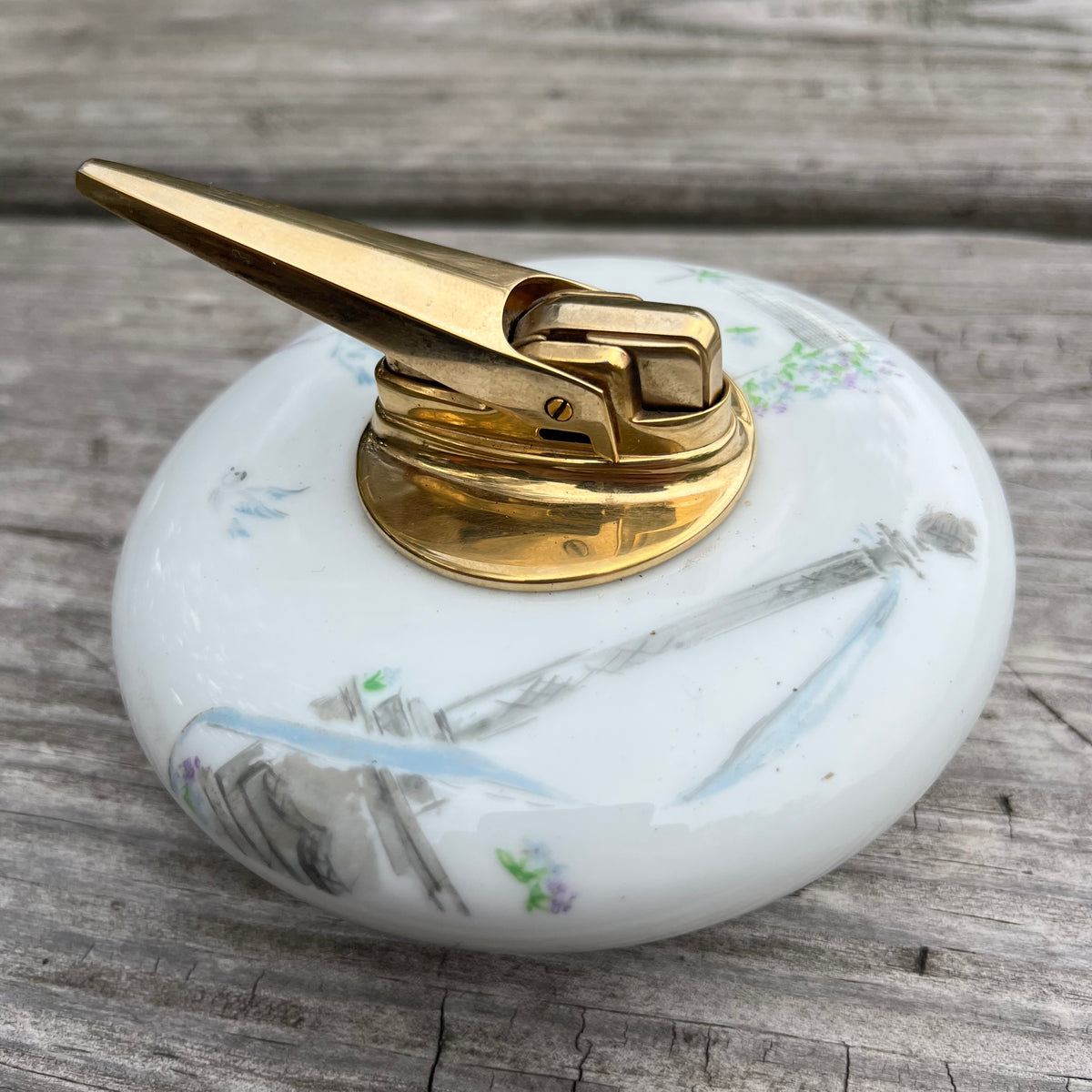 Vintage ceramic tabletop lighter.