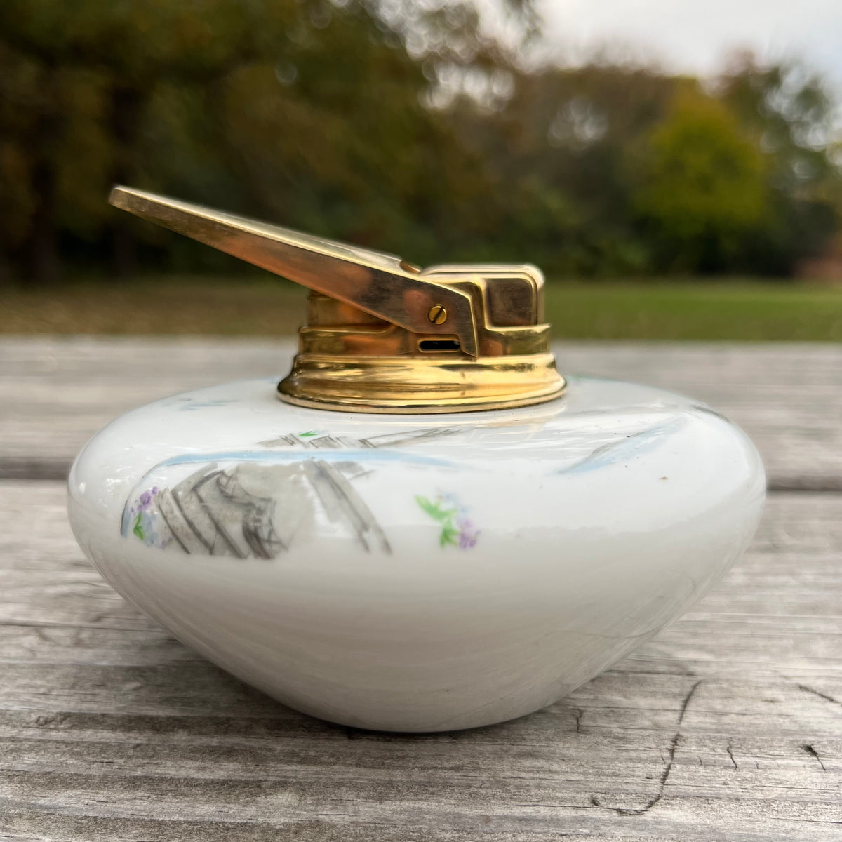 Vintage ceramic tabletop lighter.