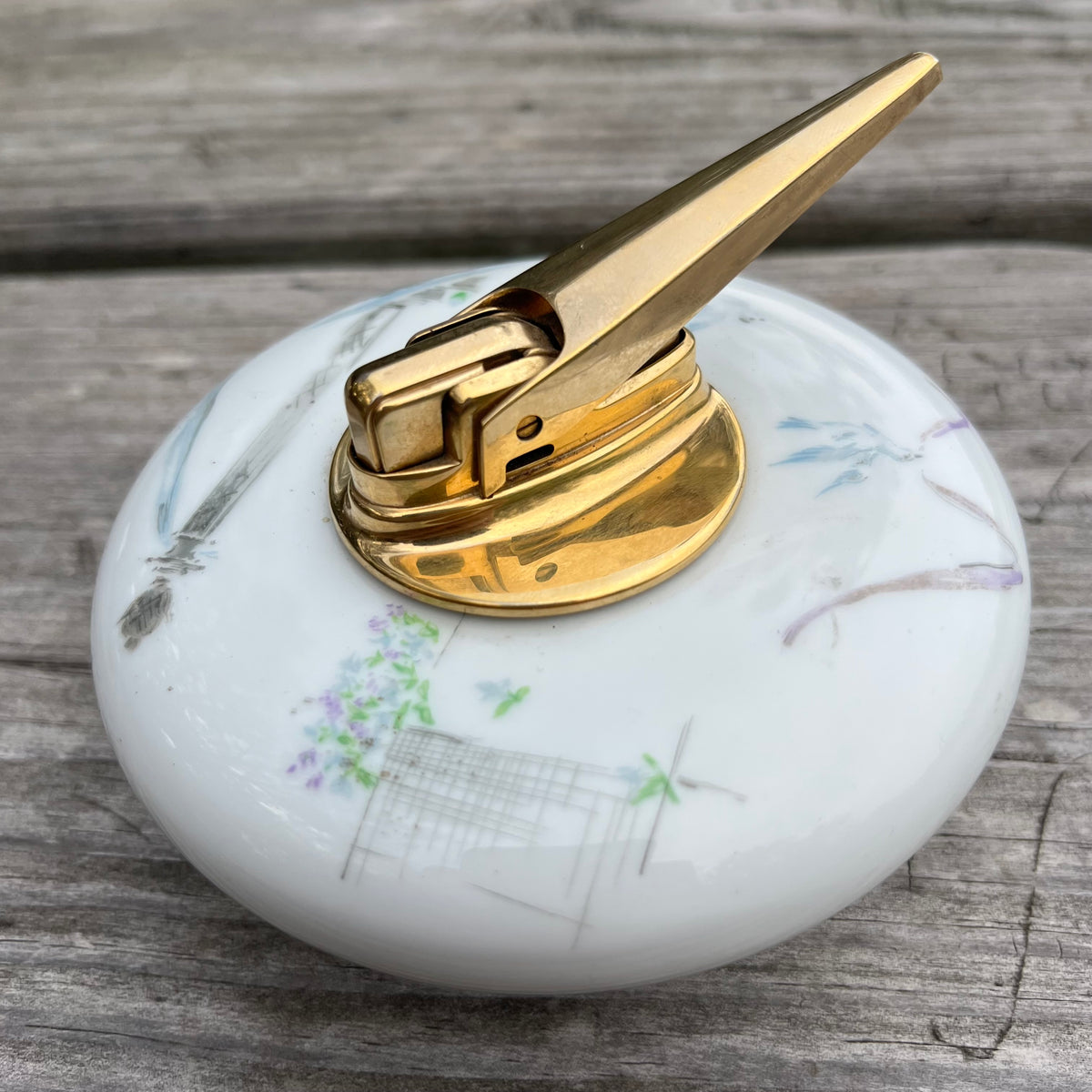 Vintage ceramic tabletop lighter.